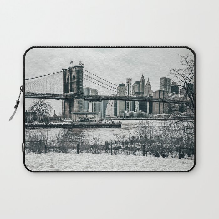 Brooklyn Bridge and Manhattan skyline during winter snowstorm blizzard in New York City Laptop Sleeve