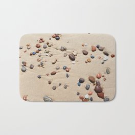 Wet sand and stones on beach Bath Mat