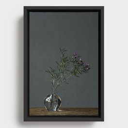 Photo print of little purple flowers in glass vase on wood Framed Canvas
