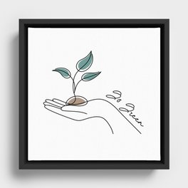 In this line art style illustration, a hand cradling a vibrant green plant. Framed Canvas