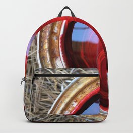 Red Paint Can on Straw Backpack