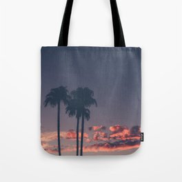 Silhouette of palm trees at sunset Tote Bag