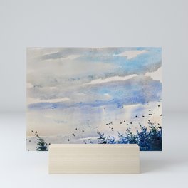 black birds, blue sky Mini Art Print
