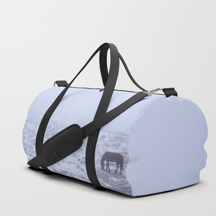 Wild horses at the mountains. Into the snowstorm. Sierra Nevada National park Duffle Bag