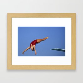 Woman diver flying through the air. Framed Art Print