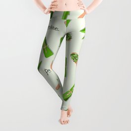 Vector seamless flat lay pattern of pandan leaves, shredded pandan spices in wooden spoon and wrapped leaves on green background Leggings