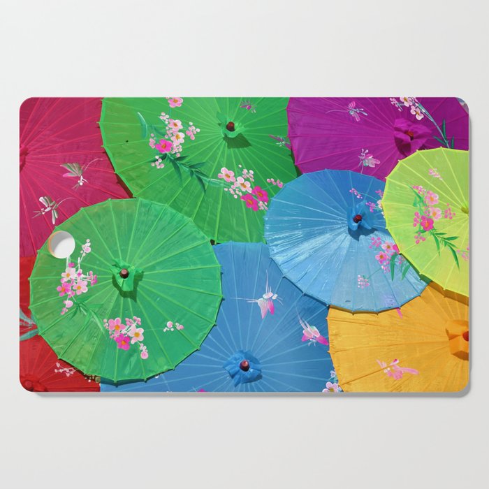 Multi-colored Chinese umbrellas / parasols with tropical pink flower petals color photograph / photography for home and wall decor Cutting Board