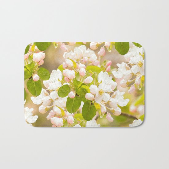 Apple tree branches with lovely flowers and buds on a pastel green background Bath Mat
