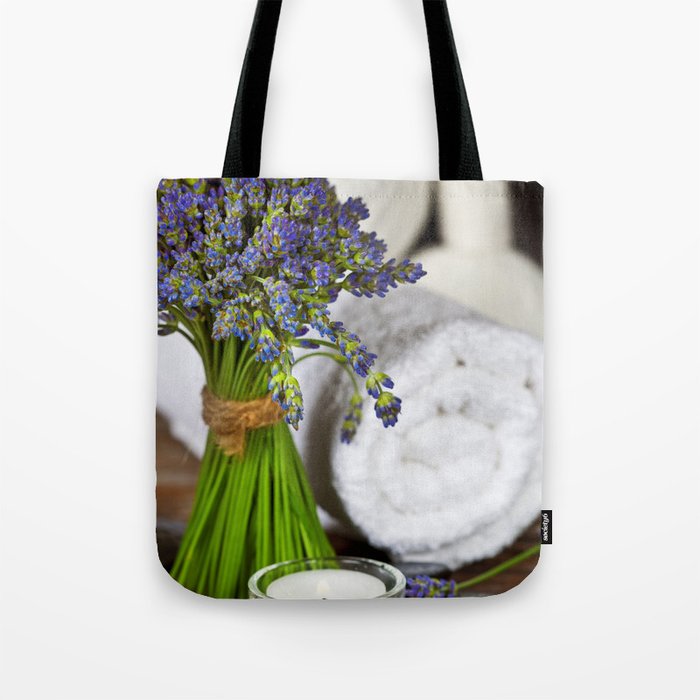 Fresh  lavender flowers, zen stones,Herbal massage balls , candle and towel over wooden surface Tote Bag