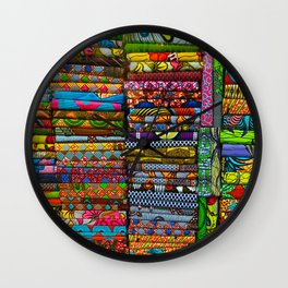 Stacks of bright colorful fabrics. Shopping, consumerism concept Wall Clock
