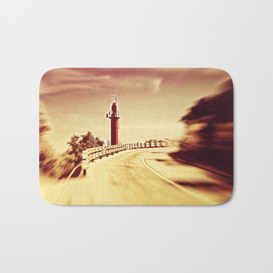 Lighthouse on the road Bath Mat
