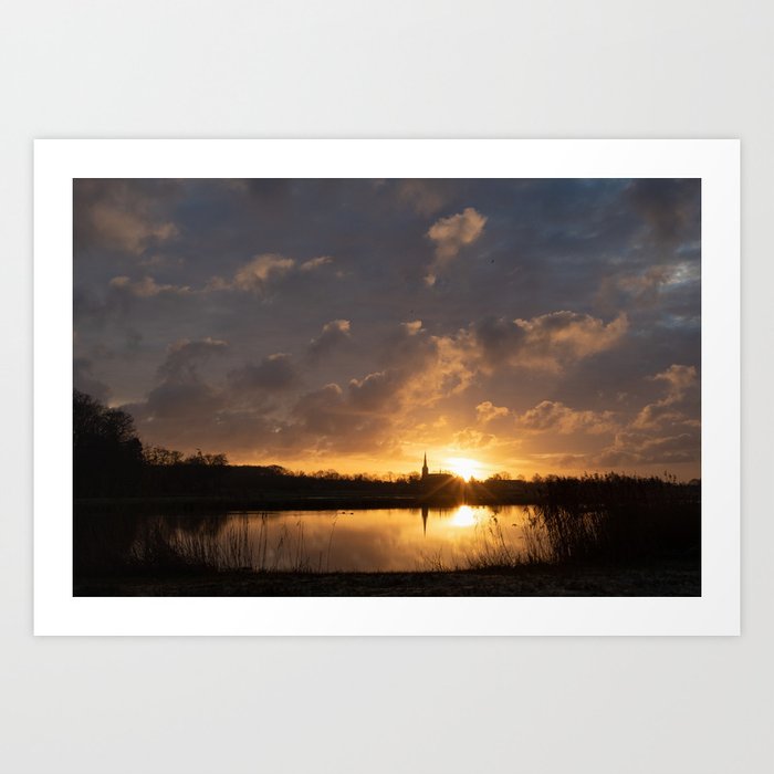Orange Sunset Reflected in a River, Church in Background | The Netherlands Art Print