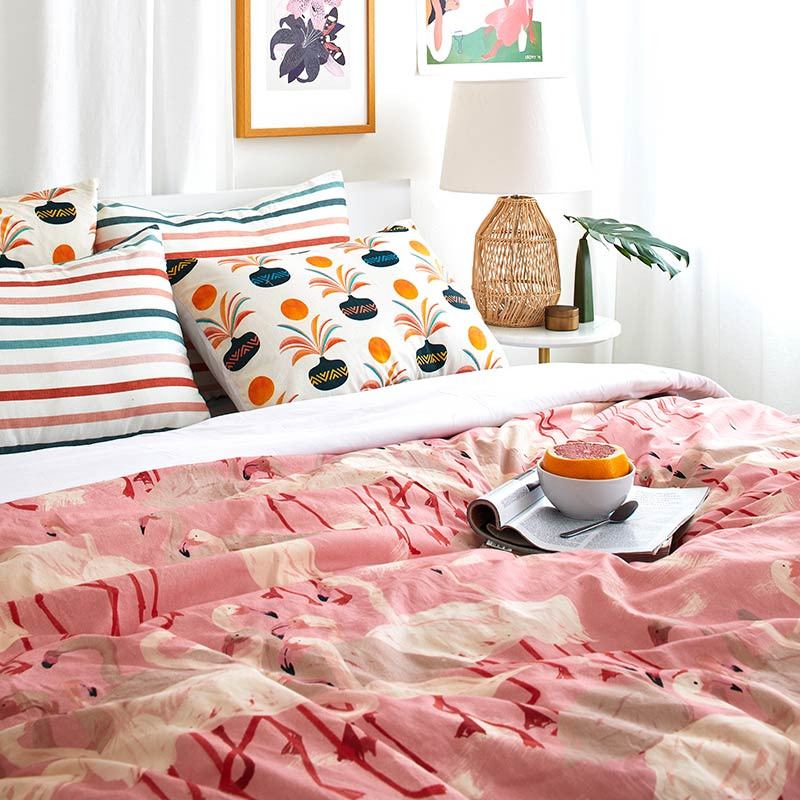 bed with pink flamingo patterned cotton duvet cover