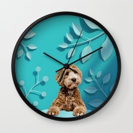Goldendoodle Laying on Pastel Blue Kirigami Leaves Background Wall Clock
