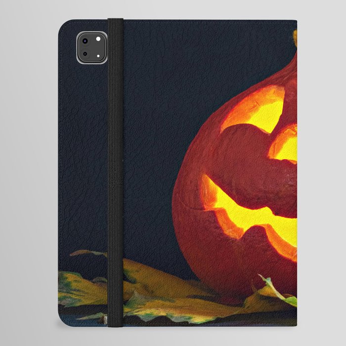 Glowing Pumpkin with Autumn Leaves on a Dark Background. Jack's Lantern. Halloween Decoration iPad Folio Case