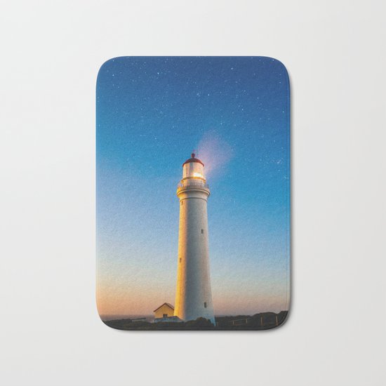 Lighthouse at night Bath Mat