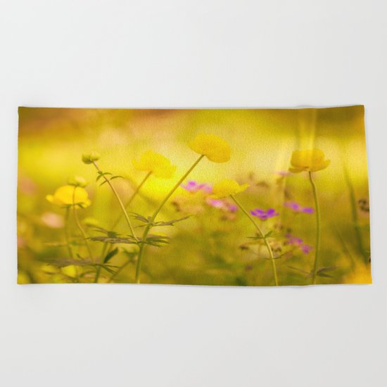 Wild flowers in the golden sunset shades Beach Towel