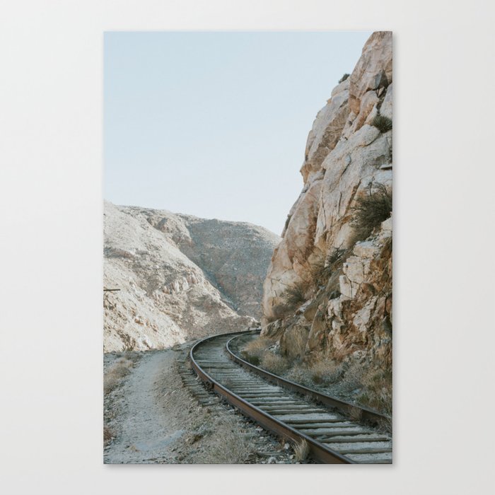 Trains winding through mountains Canvas Print