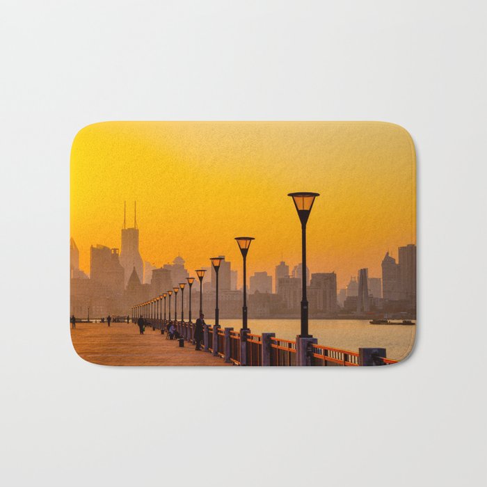 Sunset Cityscape by the River Bath Mat