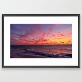 Magical sunset colors in the sky above the sea Framed Art Print