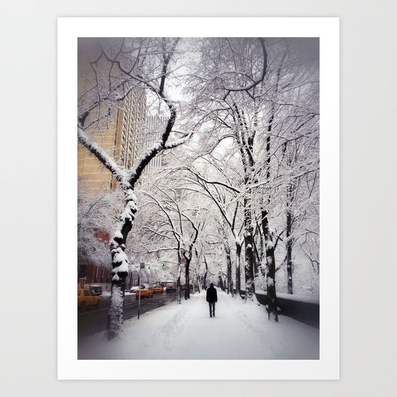 A Man Walks Under Snow Covered Trees Along New York S 5th Avenue