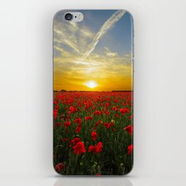 A field of flowers with sunset iPhone Skin
