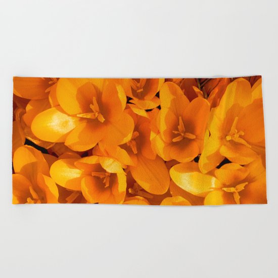 Gold in the garden Beach Towel