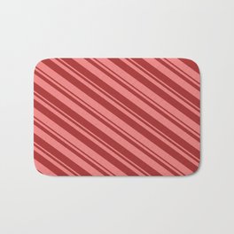 [ Thumbnail: Light Coral & Brown Colored Lined/Striped Pattern Bath Mat ]