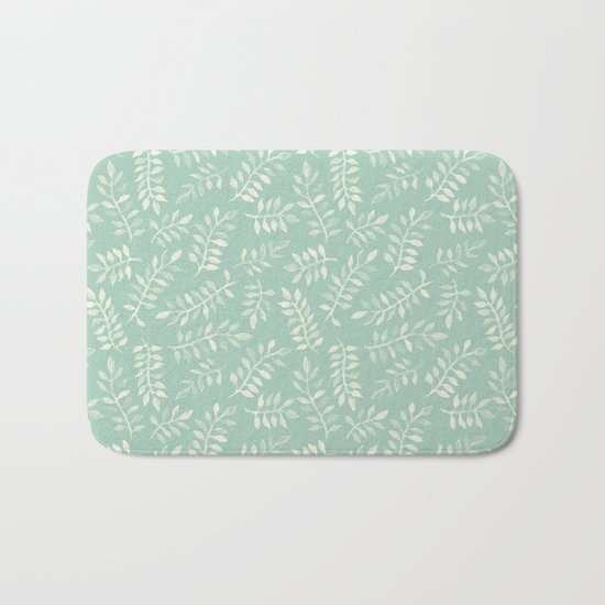 Painted Leaves - a pattern in cream on soft mint green Bath Mat