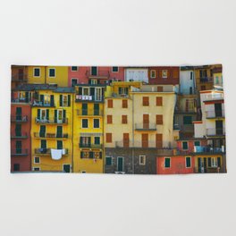 Manarola village, colorful pattern of houses. Cinque Terre, Italy. Beach Towel