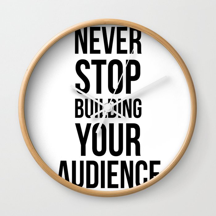 Never Stop Building Your Audience Black and White Wall Clock