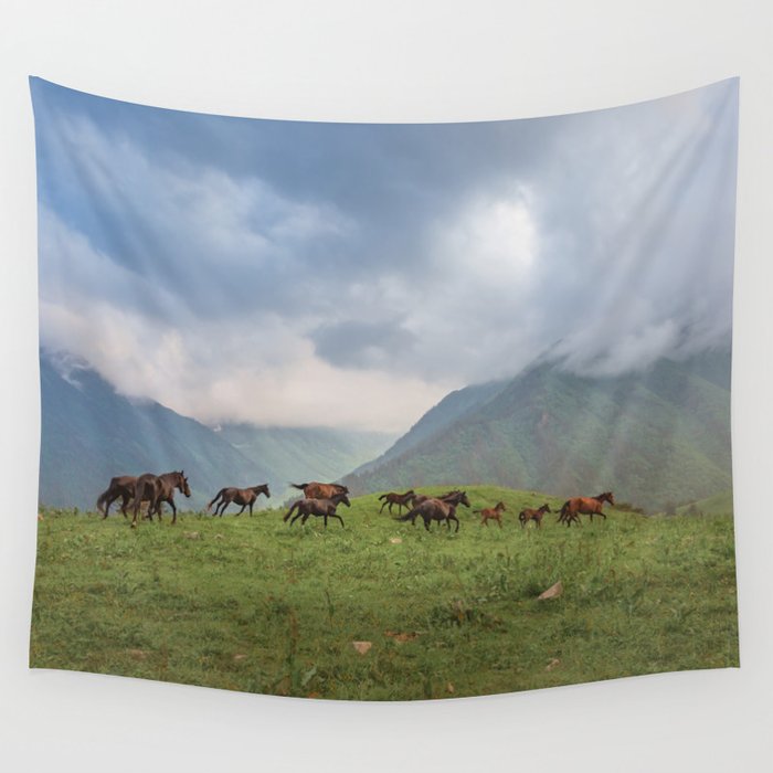 Running horses in the mountains Wall Tapestry