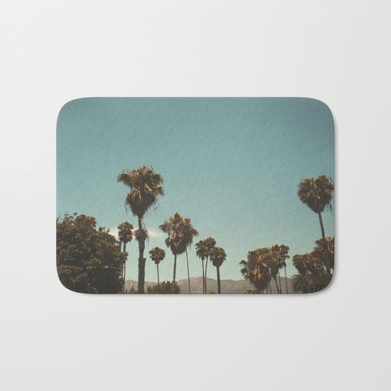 Palm trees before the mountain foot Bath Mat