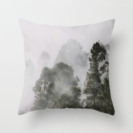 Tall forest trees above the morning mist Throw Pillow