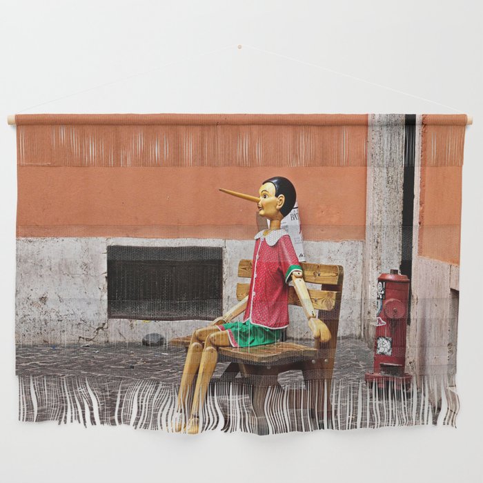 Pinocchio Marionette Sitting on Street Bench Wall Hanging