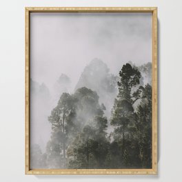 Tall forest trees above the morning mist Serving Tray