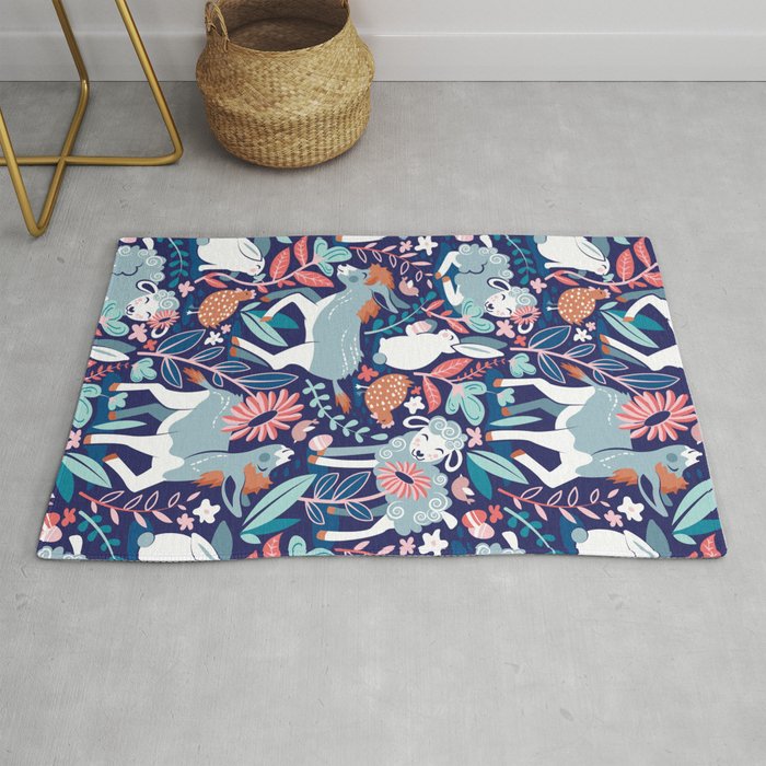 Spring Joy // navy blue background pale blue lambs and donkeys coral and teal garden Rug