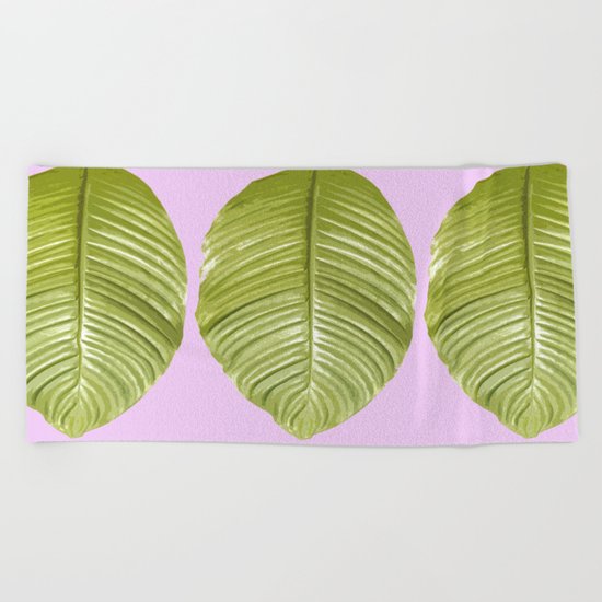 Three large green leaves on a pink background - vivid colors Beach Towel