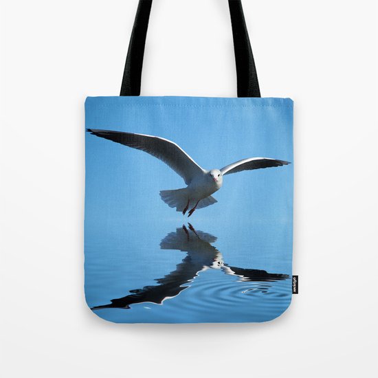 Seagull on blue sky Tote Bag