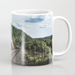 Black freight train on the railroad running across the United States Coffee Mug