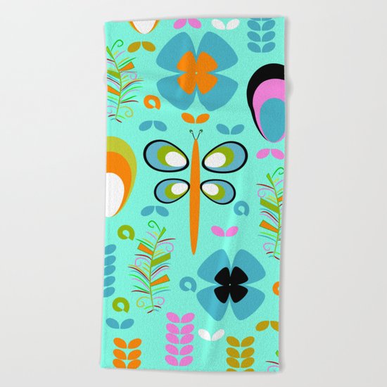 Dragonfly in the garden Beach Towel