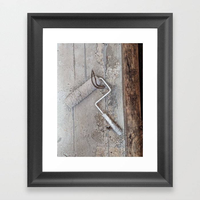 White on white paint roll with wooden piles Framed Art Print