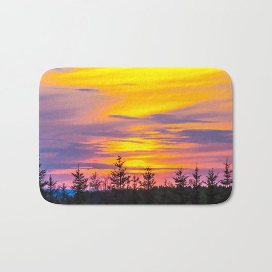 Sunset above the forest Bath Mat