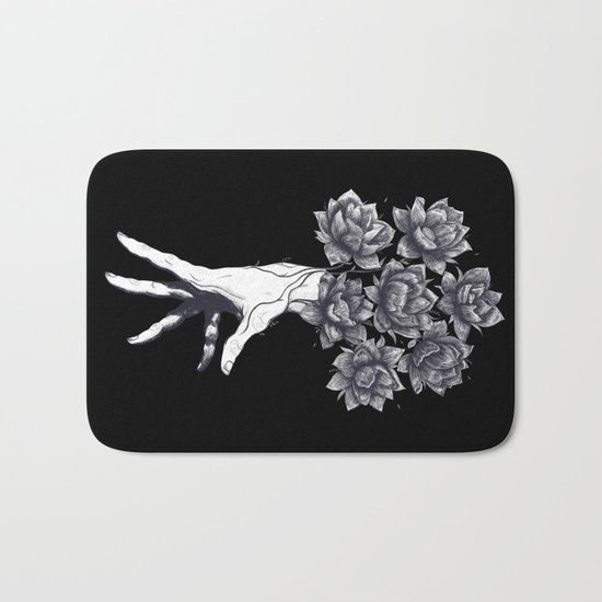 Hand with lotuses on black Bath Mat
