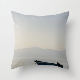 boat in middle of sea with mountains behind it in egypt  Throw Pillow