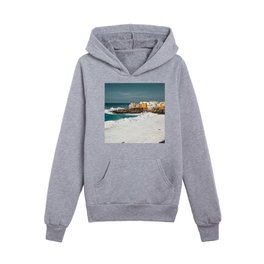 Blue Ocean Waves and Pink Yellow houses on the cliff Kids Pullover Hoodies