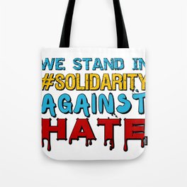 We stand in #Solidarity against hate Tote Bag