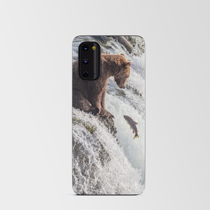 Young grizzly bear sits at waterfall Android Card Case