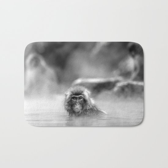 Black and White Macaque at a hot spring Bath Mat
