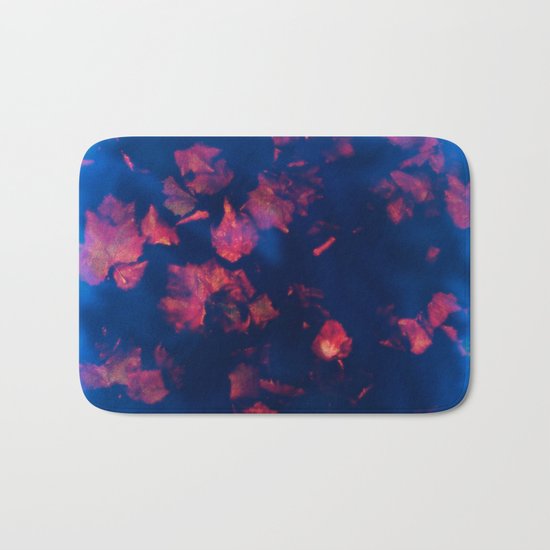 Rusty red falling leaves in dark blue water Bath Mat